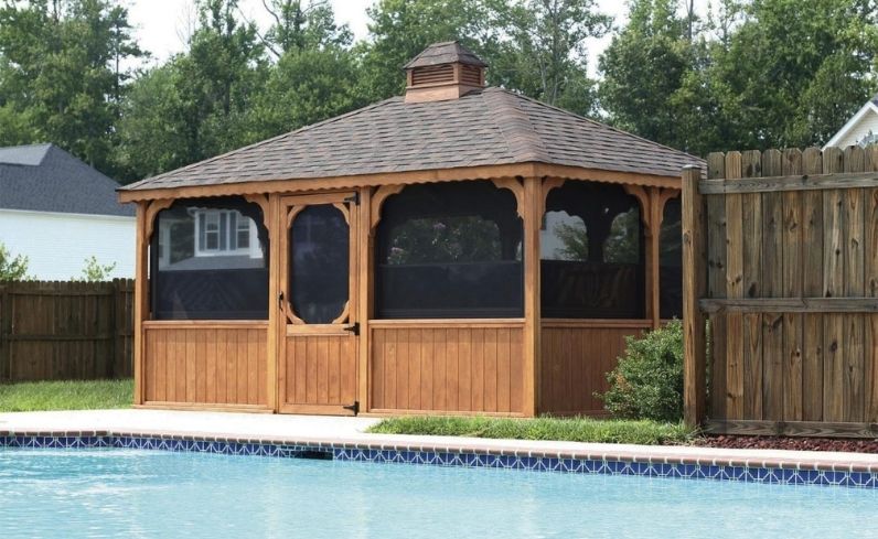 Wood gazebo accessorizing deck and pool 