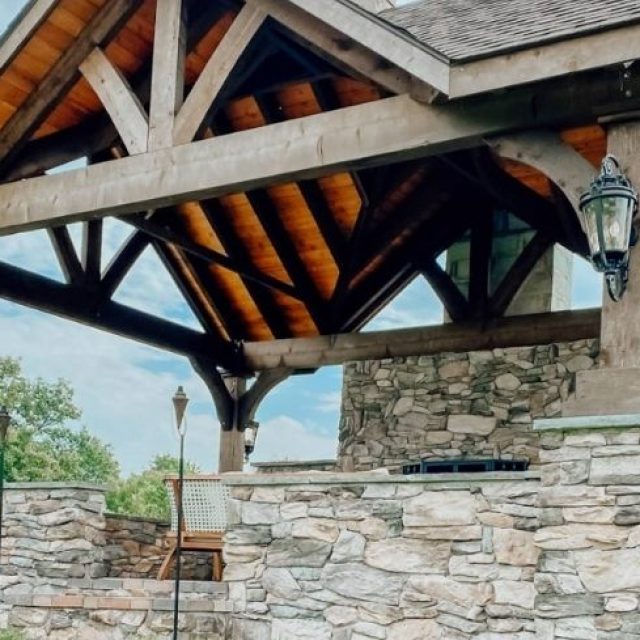 Gable roof pavilion with stone and wood