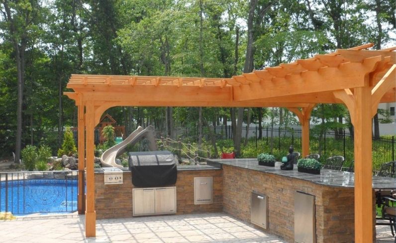 L-Shaped wood pergola style over outdoor kitchen
