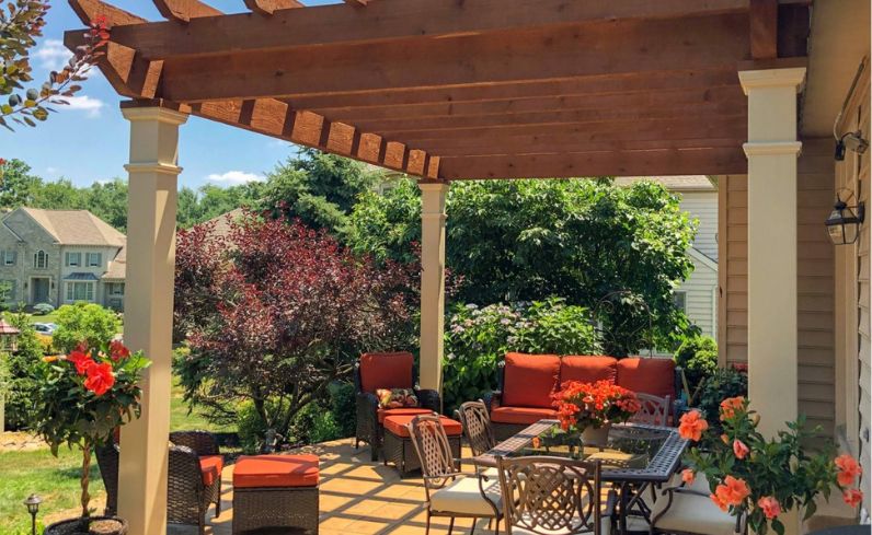 Covered backyard deck with autentic wood pergola